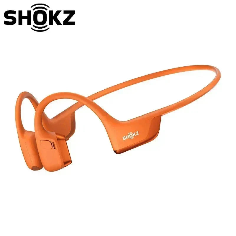 Orange SHOKZ headphones on a white background with 'SHOKZ' branding.